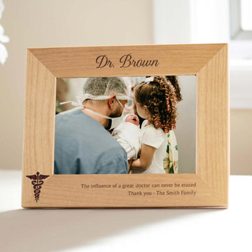 Personalized Doctor Appreciation Wood Picture Frame laser engraved with caduceus, your doctor’s name, and your special message, displayed by easel on table
