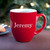 Engraved Red Coffee Mug with Name displayed in holiday setting