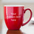 Create your own custom text oversized coffee mug with handle to the right personalized with your custom text in your font choice shown on table in the morning with breakfast.