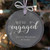 Engagement Ornament hanging on Christmas tree