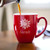 Christmas Coffee Mug (Snowflake) with coffee being poured showing daily use