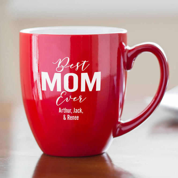 Personalized Best Mom Ever coffee mug with handle to the right personalized with your term of endearment for mom and your special text on table in the morning with breakfast.