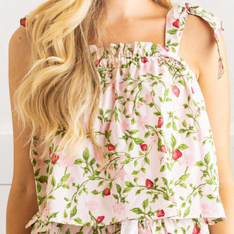 Close-up of botanical berry cotton pajama top with strawberry bud print, smocking and adjustable bow tie straps