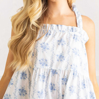 Close-up of blue rose vine floral cotton fabric with adjustable tie strap detail