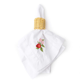 Folded white napkin with embroidered strawberry and green leaf detail (product view)