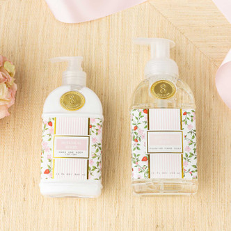 Flat lay of botanical berry lotion with pink packaging, green vines and strawberry bud design