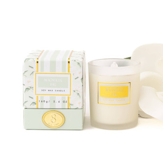 8 Oak Lane magnolia fig candle 5.6oz in glass jar with mint botanical boxed packaging (front view)
