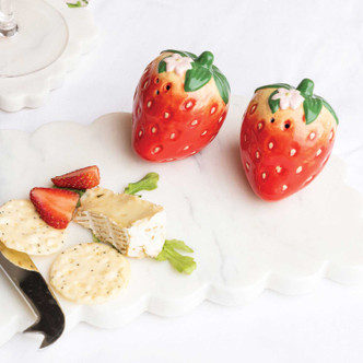 8 Oak Lane strawberry salt and pepper shaker set with red berry design and green leaf tops (lifestyle view)