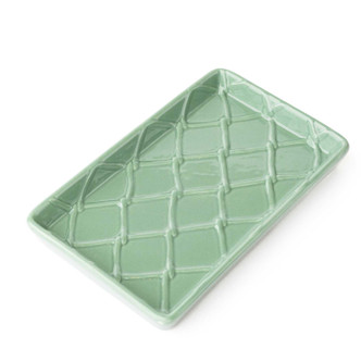 Green rectangular guest towel holder tray with textured pattern for bathroom or vanity use (angled view)