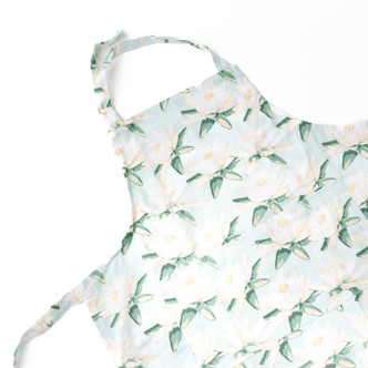 Magnolia mint kitchen apron with green retro print on white background (product view)