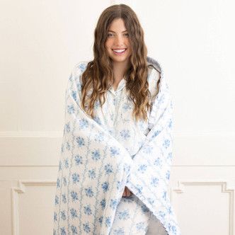 8 Oak Lane blue rose vine luxe throw blanket 56 x 60 inches with soft floral print and plush texture (lifestyle view)