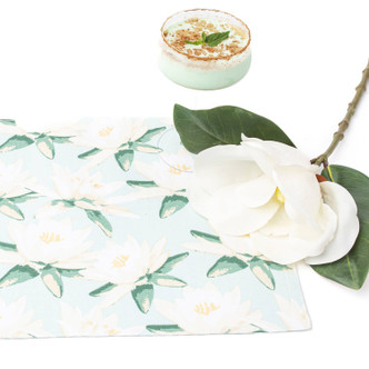 Magnolia mint placemat styled with grasshopper cocktail showing green botanical design