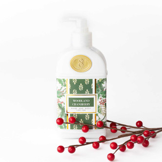 Woodland Cranberry hand & body lotion pump bottle with a green holly and berry print label