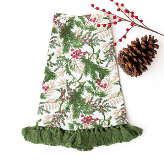 Woodland Berry print kitchen towel with green tassel trim, styled with a pinecone and berry sprig