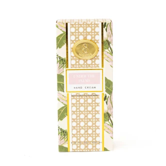 Under the Palms hand cream box and tube with a tan and pink palm frond print (alternate angle)
