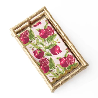 Folded paper guest towel with a pomegranate print and gold scalloped edge (alternate angle)