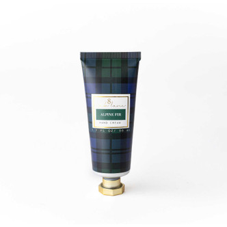 Alpine Fir travel hand cream tube in a navy and green plaid print