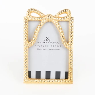 Gold-tone picture frame shaped like a wrapped ribbon with a bow at the top (alternate angle)