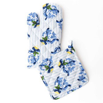 Holiday Chinoiserie oven mitt and pot holder set with a blue floral and bow print