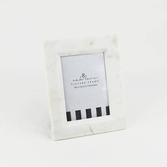 White marble picture frame with a clean squared silhouette and easel back holding a 5x7 photo