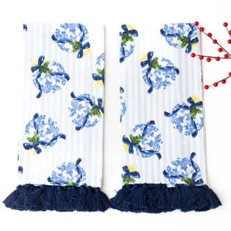 Two Holiday Chinoiserie kitchen towels with navy tassel fringe trim (alternate angle)