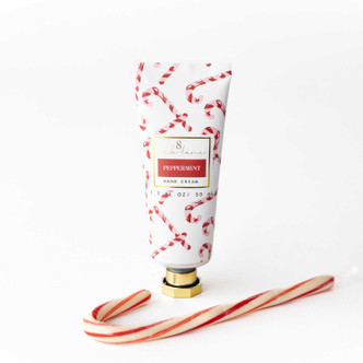 Peppermint Candy Cane travel hand cream tube in a red and gold lattice print