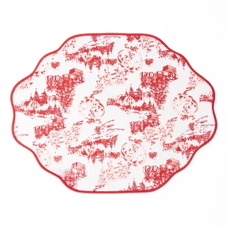 Santa Toile reversible scalloped placemat with a red village toile print and red striped reverse side (alternate angle)
