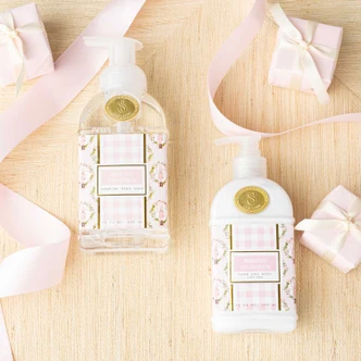 Frosted Sugarplum hand and body lotion bottle in a pink gingham nutcracker print (alternate angle)