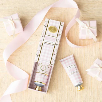 Frosted Sugarplum hand cream box and tube in a pink gingham nutcracker print (alternate angle)