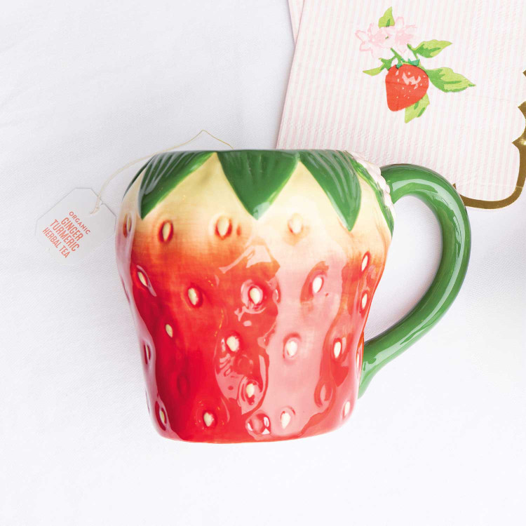 8 Oak Lane strawberry coffee mug with textured red berry design and green handle (front view)