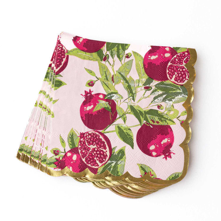 Stack of pomegranate-print beverage napkins with scalloped gold foil edges