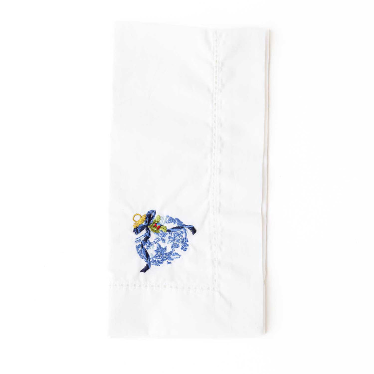 White cotton dinner napkin embroidered with a blue chinoiserie ornament motif