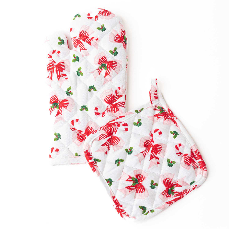 Holly Jolly Bows oven mitt and potholder set with red bows and candy canes on white