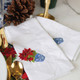 Detail of 8 Oak Lane Poinsettia Embroidered Dinner Napkin