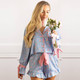 8 Oak Lane women’s satin pajama set in blue bud floral print with long sleeve button-down top and ruffle trim shorts (front view)