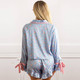 Back view of women’s satin pajama set with floral print and relaxed fit