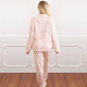 Back view of women’s long sleeve pajama set in pink bow toile print with relaxed fit pants