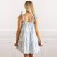 Back view of women’s blue floral cotton sleep dress with adjustable straps and relaxed fit