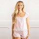 8 Oak Lane women’s pink gingham cotton pajama set with strawberry print, cap sleeve top and ruffle hem shorts (front view)