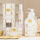Styled bathroom display with botanical berry hand soap and coordinating bath products in pink floral packaging