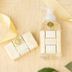Flat lay of oatmilk honey foaming hand soap with soft beige packaging and coordinating bath products