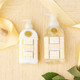 Flat lay of oatmilk honey lotion with soft beige packaging and coordinating bath products