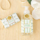 Magnolia fig foaming hand soap bottle with pump dispenser in mint and green floral pattern (product view)