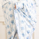 Close-up of blue rose vine throw blanket with floral pattern and soft velvety texture detail