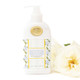 8 Oak Lane oakwood cedar hand and body lotion in mint bottle with blue rose pattern and gold pump (front view) 