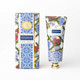 Cinnamon Fig hand cream box and tube in a blue-and-white tile print with poinsettia accents