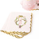 Pink gingham paper beverage napkin with a nutcracker in a floral wreath and gold scalloped edge (alternate angle)