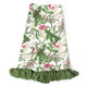 Woodland Berry print kitchen towel with green tassel trim, styled with a pinecone and berry sprig (styled detail view)