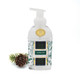 Alpine Fir foaming hand soap pump bottle with a green plaid forest print, styled with a pinecone