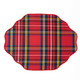 Reversible placemat with a red nutcracker toile print on one side and red tartan plaid on the other (styled detail view)